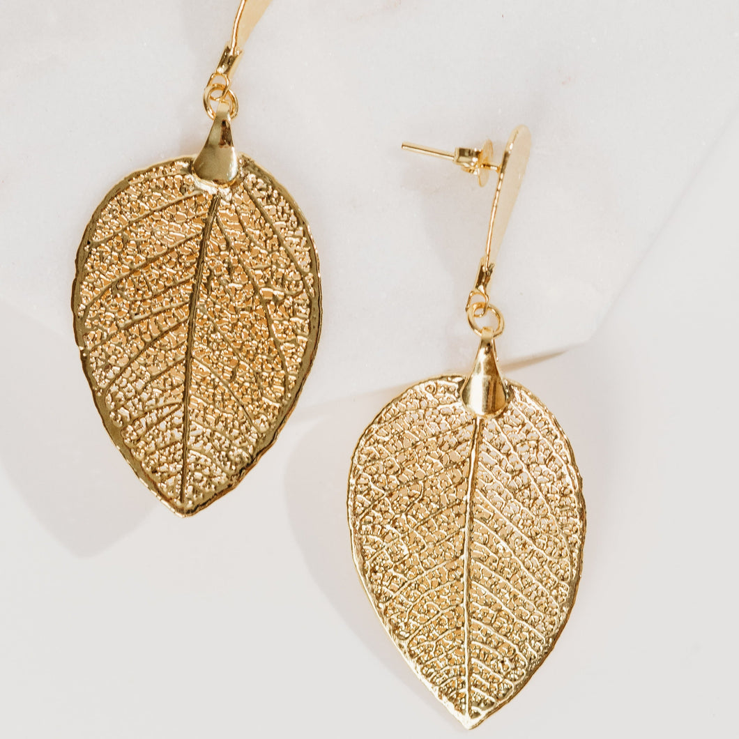 plant dangling gold earrings
